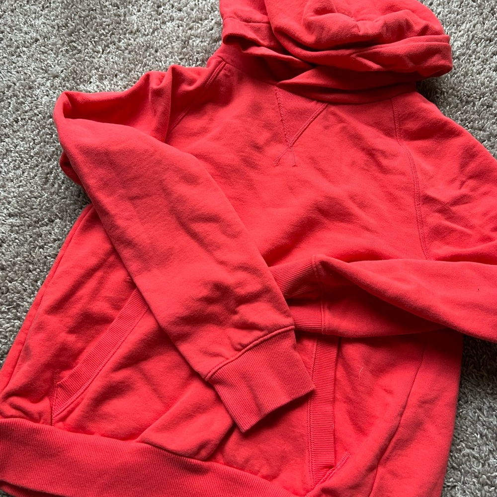 Athleta red sweatshirt with slit in back
